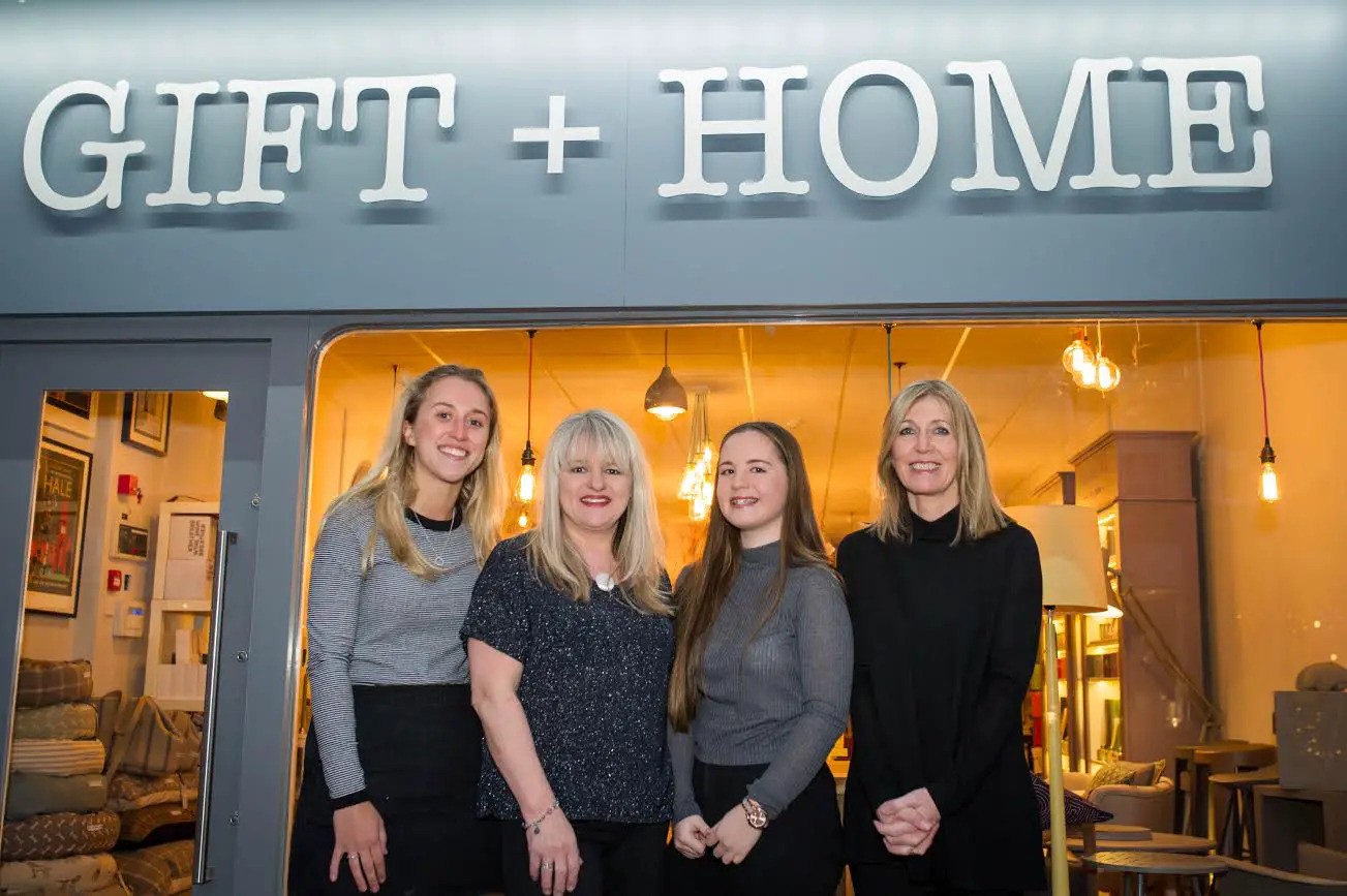 Staff in front of the shop